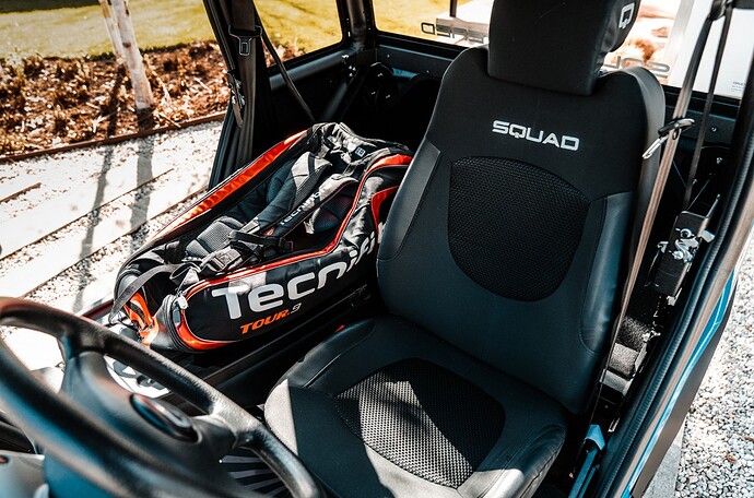 1 Squad Solar City Car seat folded down tennis bag