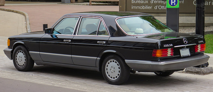 1991_Mercedes-Benz_350_SD_Turbo_in_Black,_Rear_Left,_07-15-2023