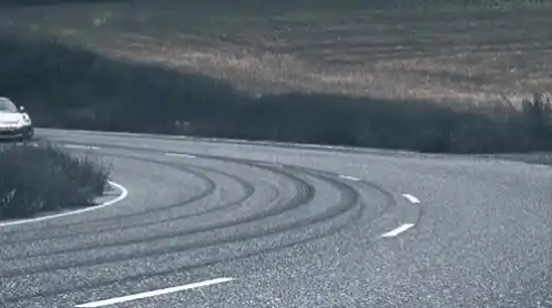 Porsche Drifting on a Winding Road
